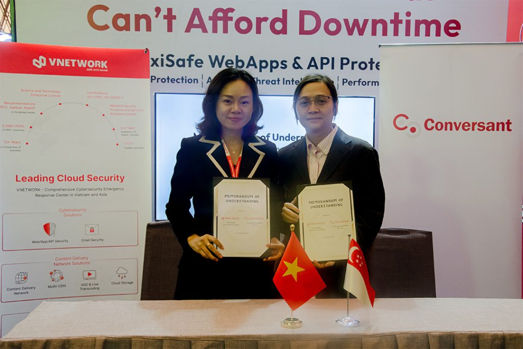 Features 2 CEOs from Conversant and VNetwork. Each holding a MOU document in agreement.