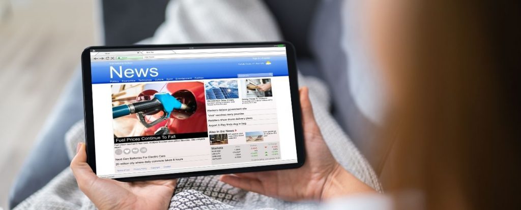 Tablet screen displaying a digital news website. Text overlay: MaxiSafe keeps a Philippine news site fast and protected from attacks.